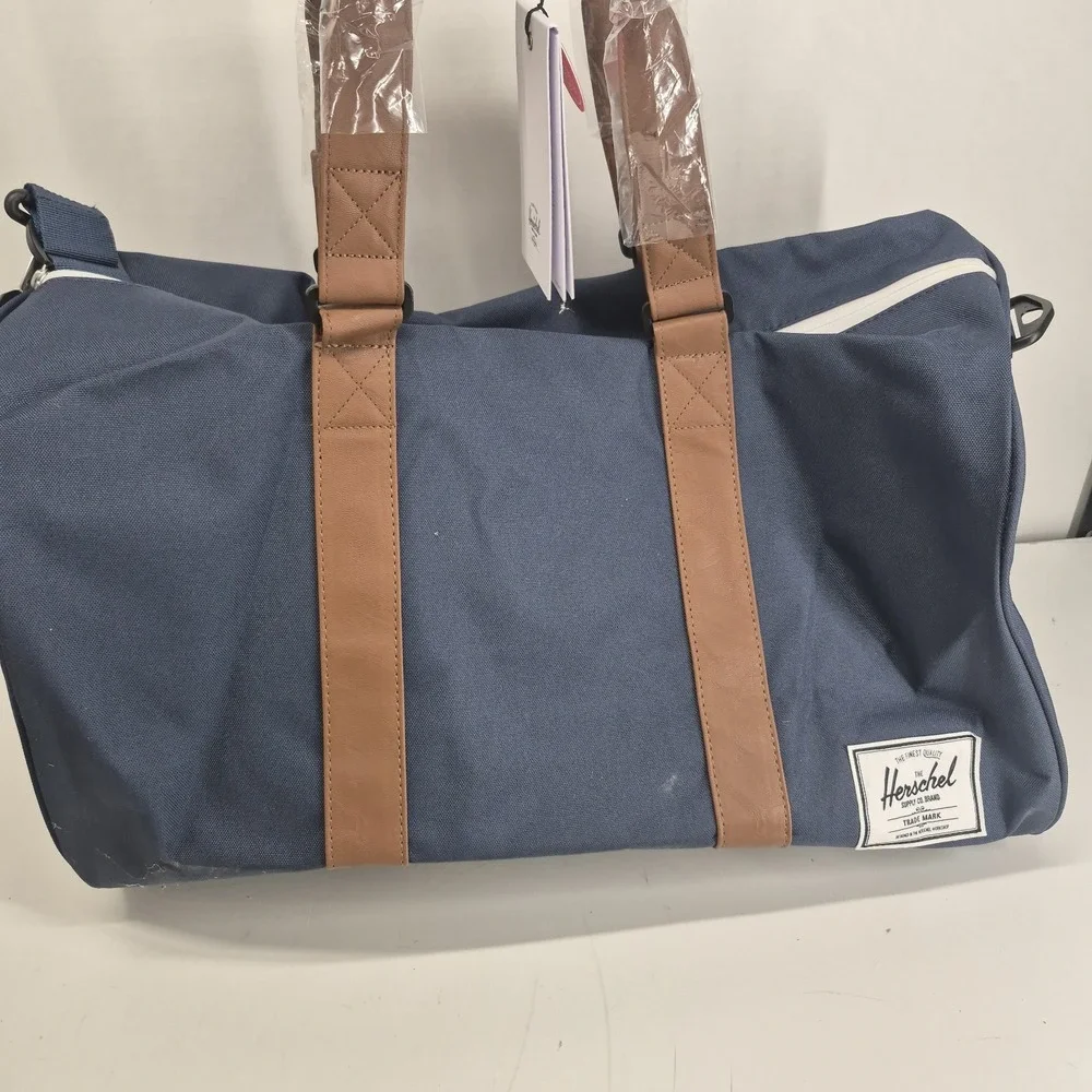 Herschel Novel Duffle Bag Navy Tan Retail: $120